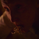 Fungal strands protrude from the mouth of an elderly woman in a scene from HBO's The Last of Us.